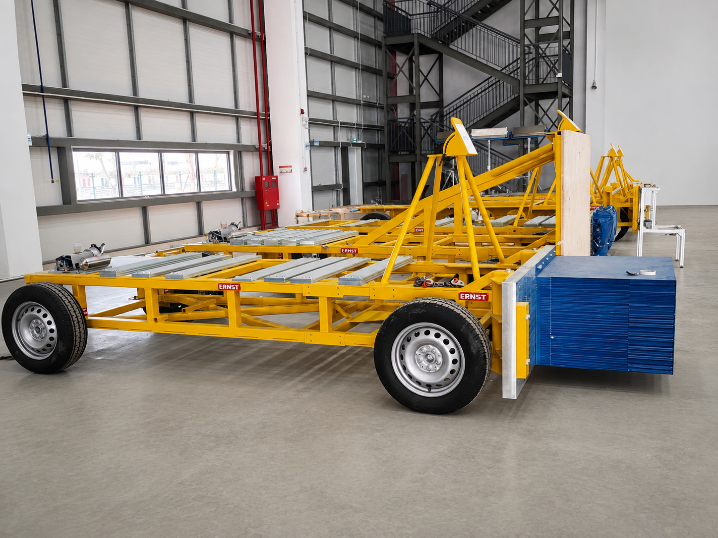Yellow ERNST mobile barrier systems inside the VinFast crash laboratory